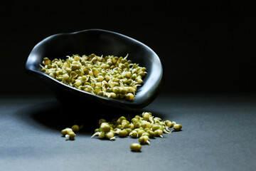 Mung bean in a bowl with a dark background, Cooking concept