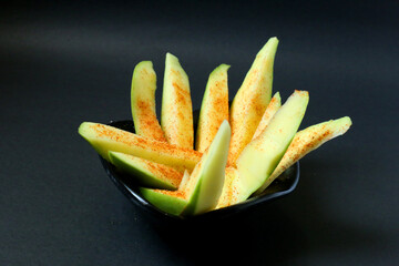 mango slices with salt and chilli powder. Fresh green mango with mixed salt and ground chilli...