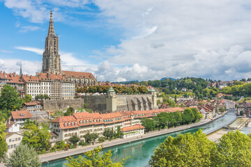 Fototapeta premium Cityscape of Bern, Switzerland, with dominant Bern Minster cathedral and the Aare river