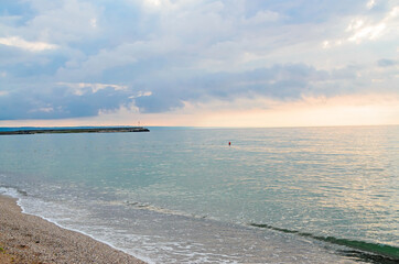 Beach of Black Sea from Golden Sands, Bulgaria with blue clear water, fluffy clouds sky, hotels
