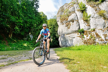 A man on a mountain bike- Jura Krakowsko- Częstochowska, Poland.  © Tomasz Warszewski