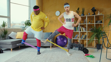 Comical retro style couple of guys stretching legs with elastic bands in funny way doing home workout. Concept of training, fun and sports.