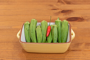 Orka and red chilli in a terracotta baking disk © ernest