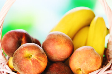 Fresh peaches and bananas. Summer fruits. Healthy food background.