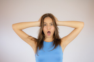 Fototapeta premium Pretty young girl making the surprise gesture