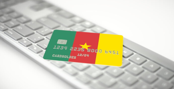 Credit card depicting flag of Cameroon on computer keyboard. Fictional numbers - Powered by Adobe
