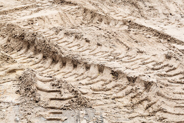 Footprints in the sand car in back light morning light. Selective focus, space in the zone blurring compositions for the production of advertising.