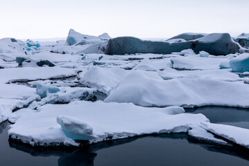 Panorama on Winter Jokulsarlon Glacier is an icy beach where ice floes float