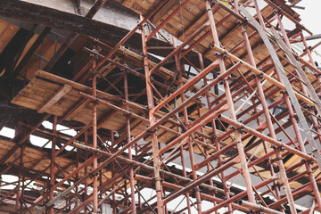 Obraz premium Supporting scaffold construction. Renovation of old bridge