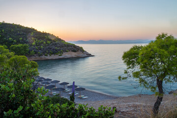 Fototapeta na wymiar Amazing beach at blue hour (sunset time) on awe greel islands (Spetses island)