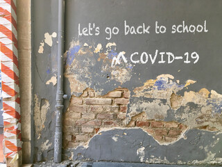 Peeling wall with back to school writing