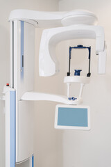 Close up dental 3D x-ray digital scanner panorama machine in clinic. Copy space on display