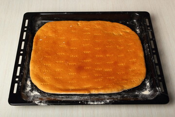 Freshly baked flatbread in baking sheet. Making Flatbread.