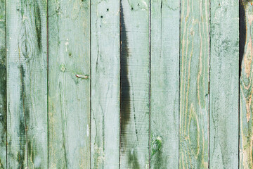 Background gloomy charred wooden fence in dark colors