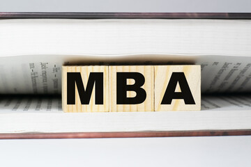 MBA a word made from building blocks in a book