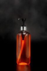 Liquid soap. Isolated on black background