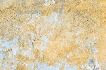 Abstract creative background of chaotic strokes of old cracked paint on concrete wall. Old surface with traces of paint, weathered, scratches and cracks for design