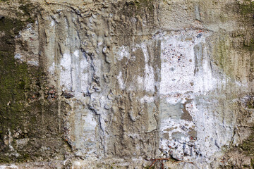 Great colorful background or texture. Abstract concrete is aged with cracks, scratches and remnants of old paint in different shades. Rough concrete surface