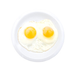 Fried eggs in the place on white