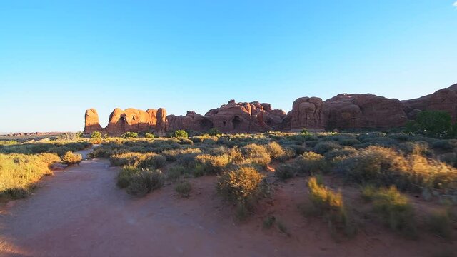 Point of view pov walking on hiking trail to Double arch in Arches National Park in Utah in summer USA road trip with bunny rabbit animal