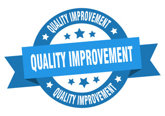 quality improvement round ribbon isolated label. quality improvement sign