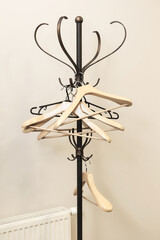 Empty hangers for clothes hanging on a metal stand curly