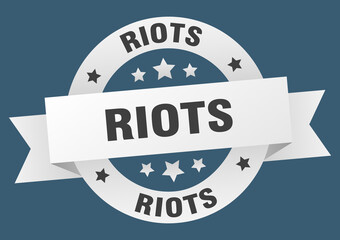 riots round ribbon isolated label. riots sign