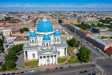 Obraz premium Saint Petersburg from a height. Russia. View of the Trinity Cathedral from a drone. Cathedrals Of St. Petersburg. Trinity Cathedral on a summer day. White Church with blue domes.