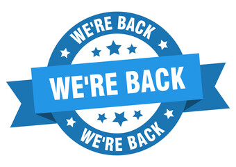 Fototapeta premium we're back round ribbon isolated label. we're back sign