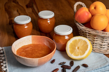 homemade apricot lemon jam. basket with apricots, a lemon and tonka beans.