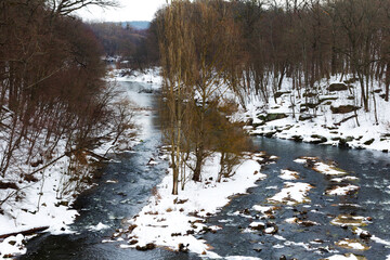 Winter landscape. Grouse River covered with ice in Zhitomir, Ukraine.