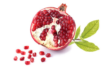 Half of pomegranate with twig isolated on white