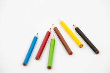 Colored pencils on white background. Stationery