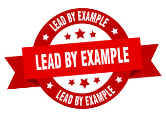 lead by example round ribbon isolated label. lead by example sign