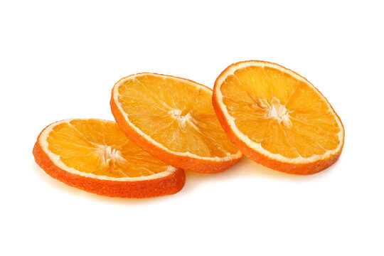 Three Slices Of Dried Orange Isolated On White