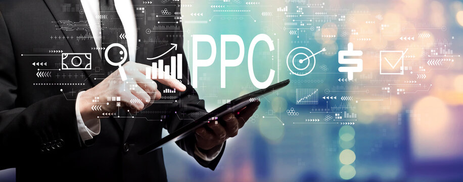 PPC - Pay per click concept with businessman using his tablet computer