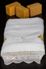 Towel with lace. Natural soaps at the back.