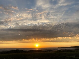 Sunset over the sea at a British beach