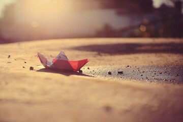 Fototapeta na wymiar little paper boat at sunset