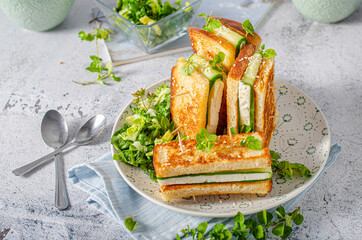Fresh snack with cheese and cucumber