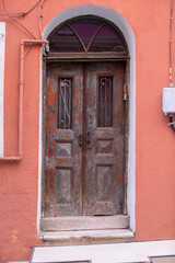 old door and window of stone building