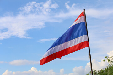 The thailand flag on wood pole have sky background