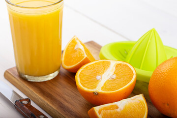 Fresh orange juice on a white table.