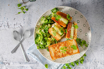Fresh snack with cheese and cucumber