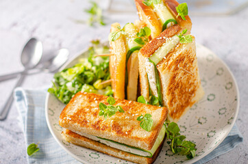 Fresh snack with cheese and cucumber