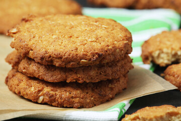 Homemade oatmeal cookie at dark background