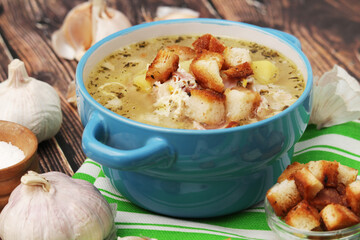A bowl with traditional Czech garlic soup cesnecka	