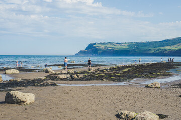 seaside landscape, beach and mountains, summer climate
