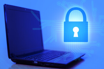 The lock next to the laptop. Network security, data protection, and PC antivirus protection....