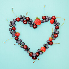 Different berries photography , heart shape